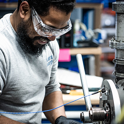 Employee working with safety glasses
